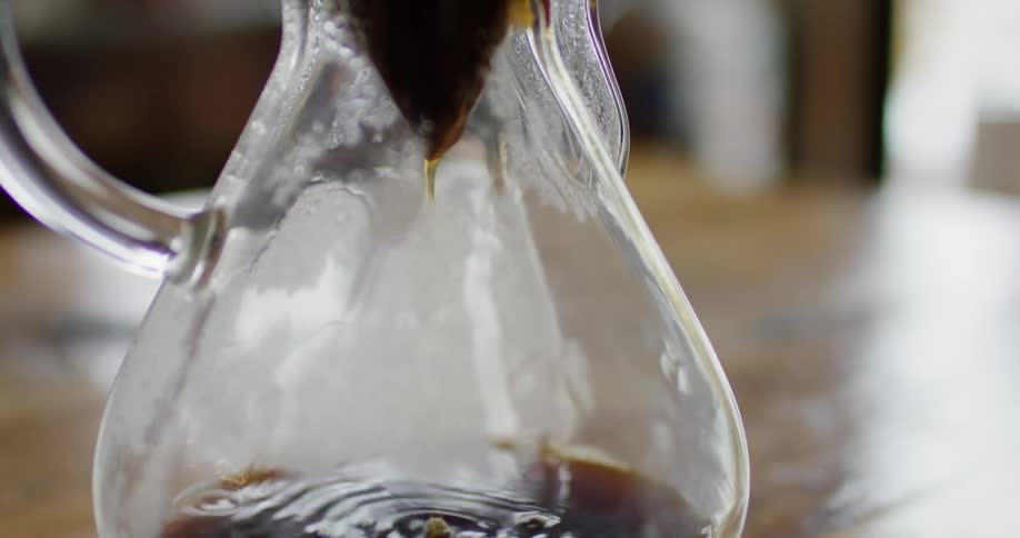 Coffee dripping from a filter into a glass pot