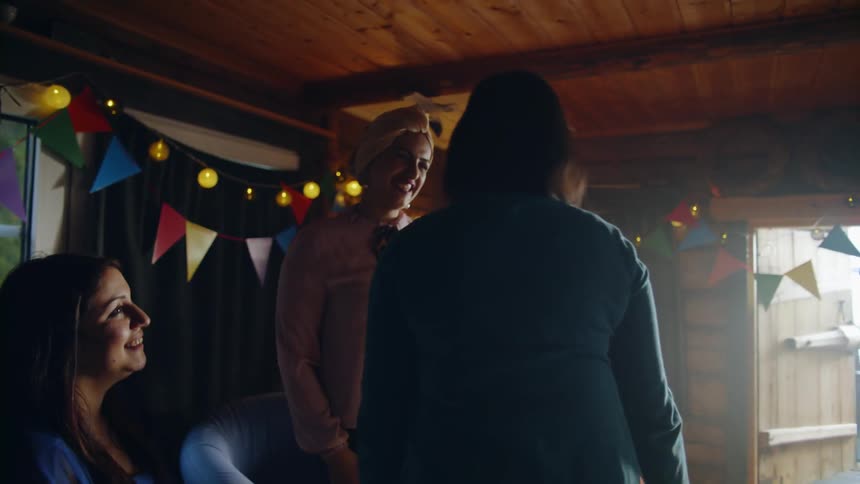 Women hug at a party