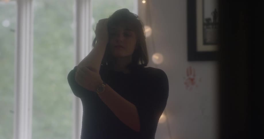 A woman sways and dances