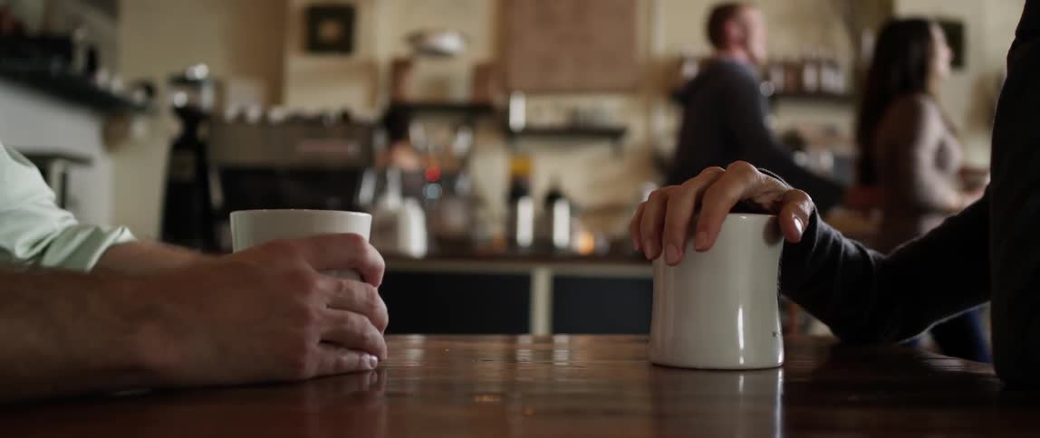 People have coffee in a cafe