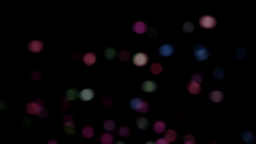 Glitter falling and shining in the dark