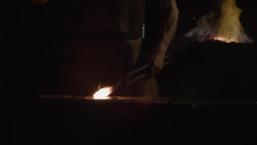 Blacksmith In Workshop