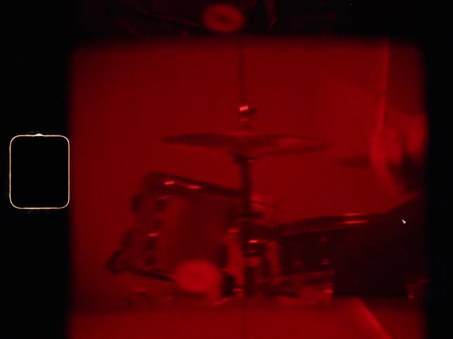 Man Playing On Pile Of Clothes In Studio