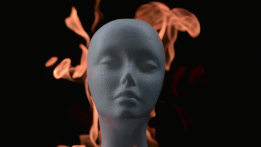 The mannequin head burns and melts