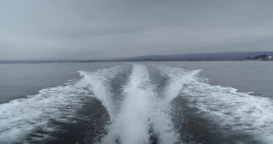 A boat floats on a lake