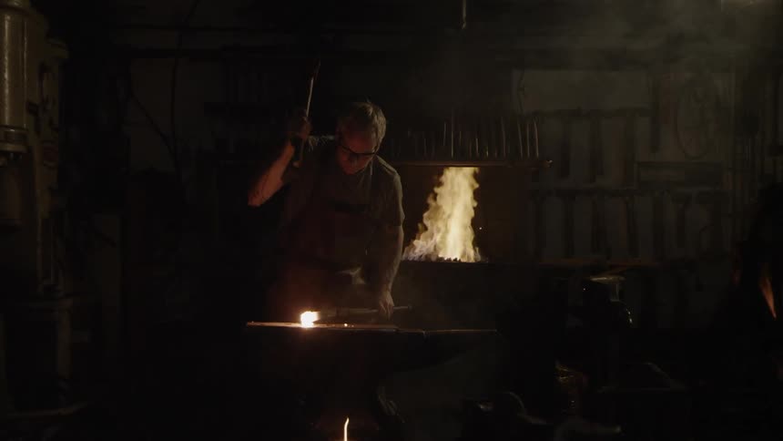 Blacksmith In Workshop