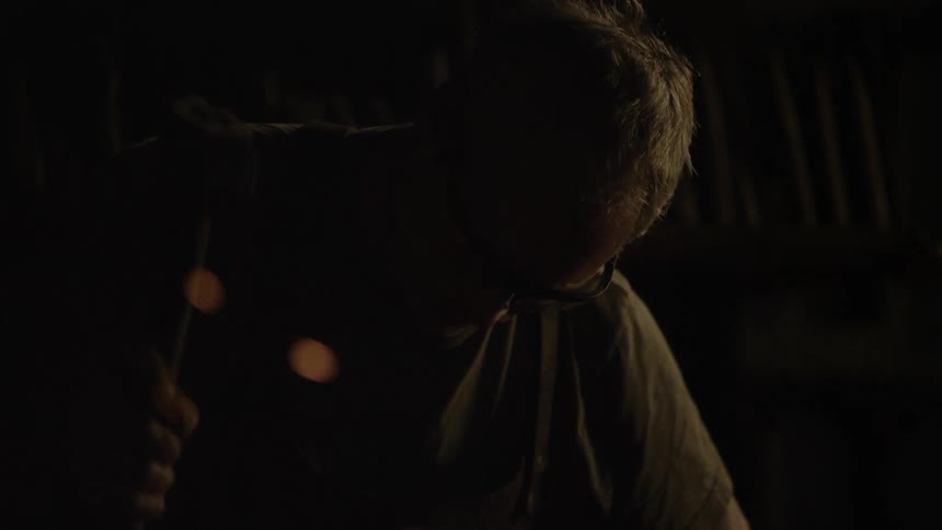 Blacksmith In Workshop