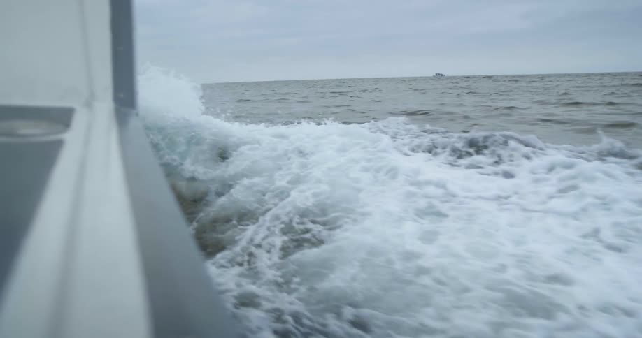 A boat floats on an ocean