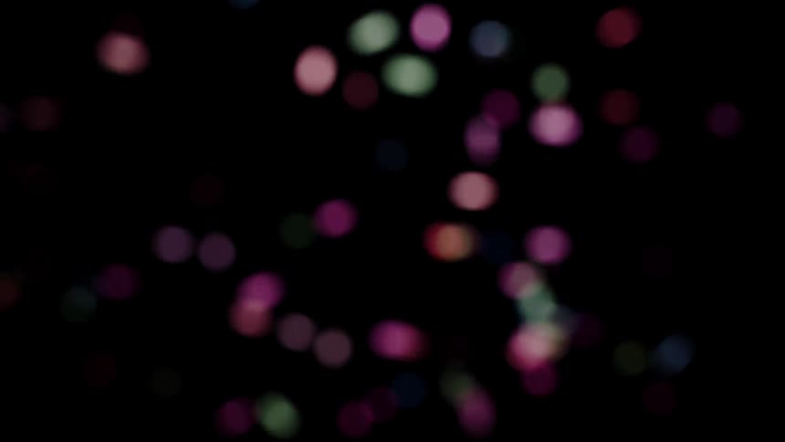 The confetti slowly falls in the dark
