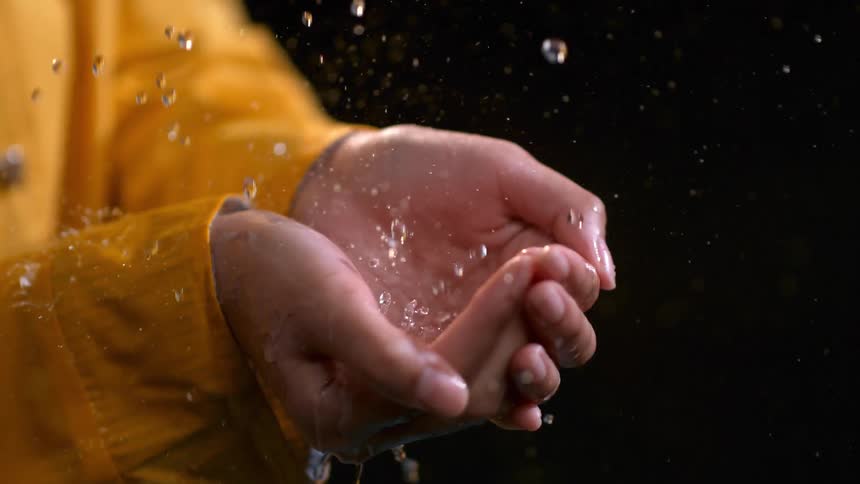Raindrops Falling On Girl In Studio