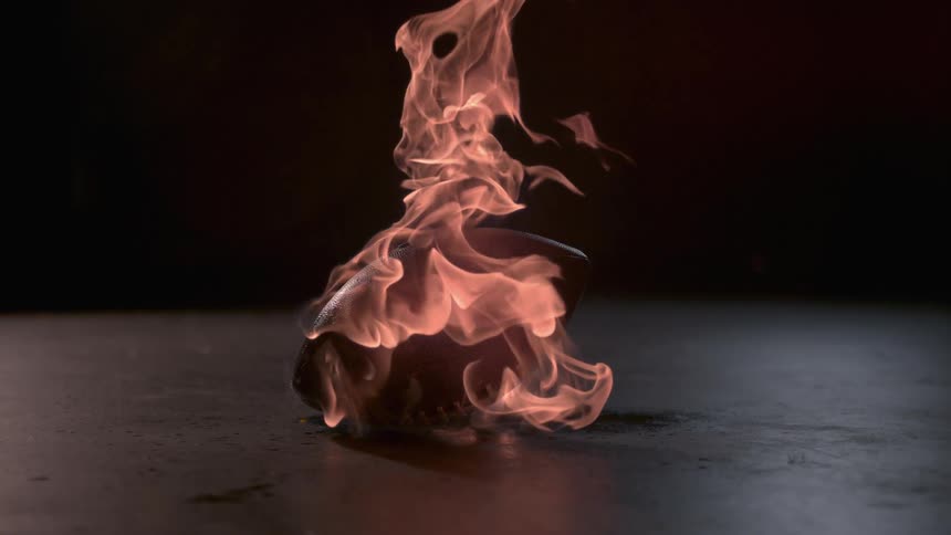 The football on the ground is on fire