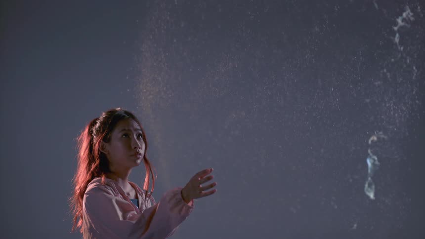 A woman pops an enormous bubble