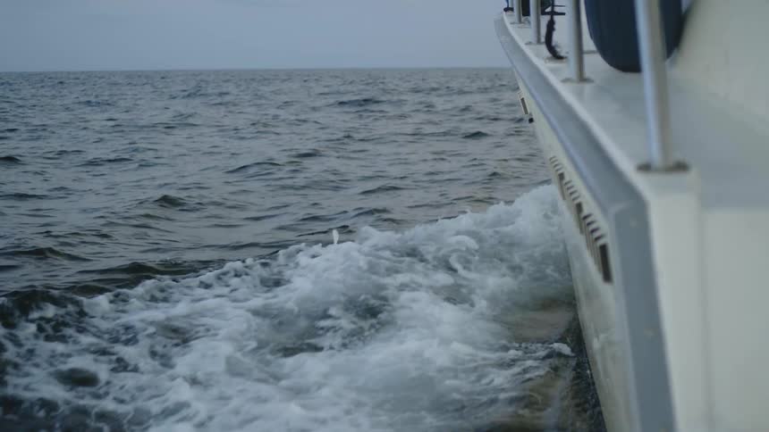 A boat floats on an ocean