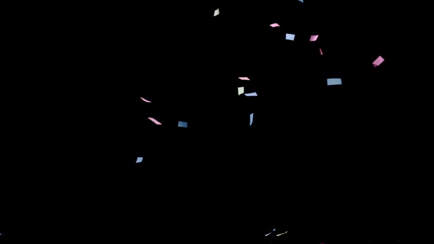 Colored confetti falls against a black backdrop