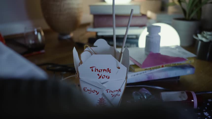 A chinese food container is on the table