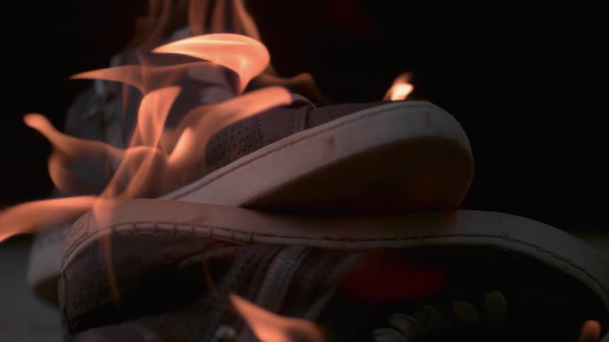 A pair of shoes is on fire