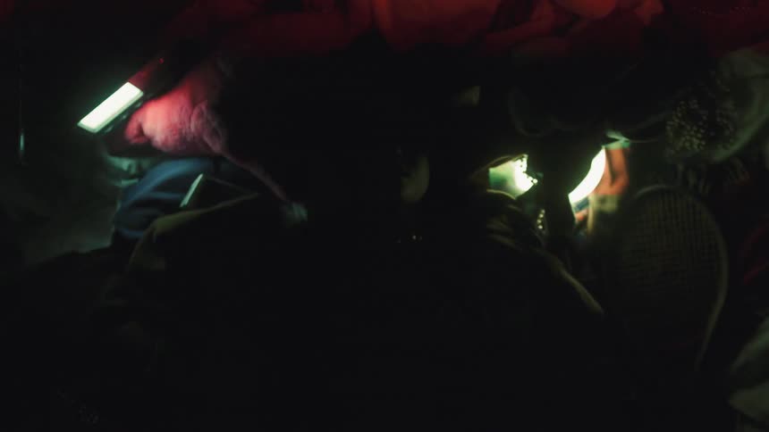 Man Playing On Pile Of Clothes In Studio
