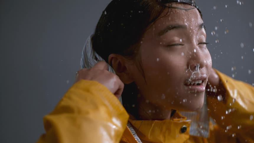 Raindrops Falling On Girl In Studio