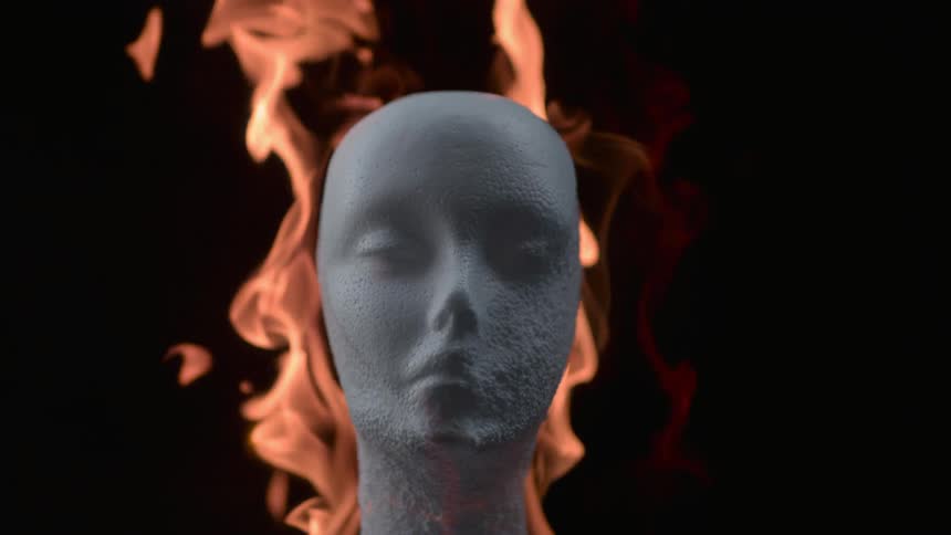 The mannequin head is on fire