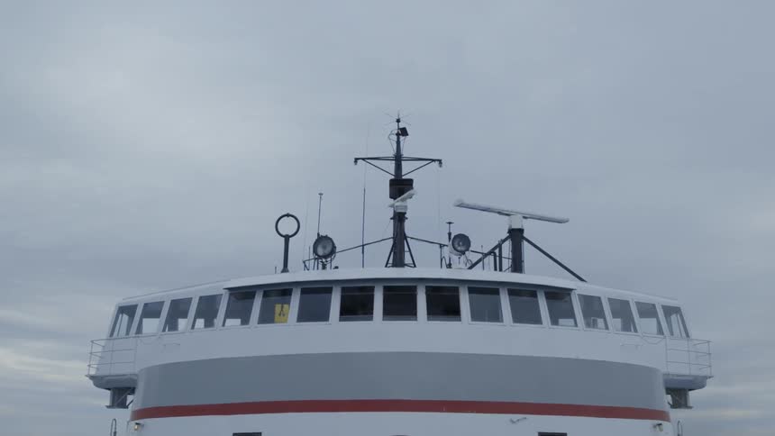 Antenna on top of a ferry turn on a cloudy day