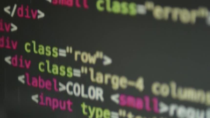 Html programming code is being displayed on a computer monitor