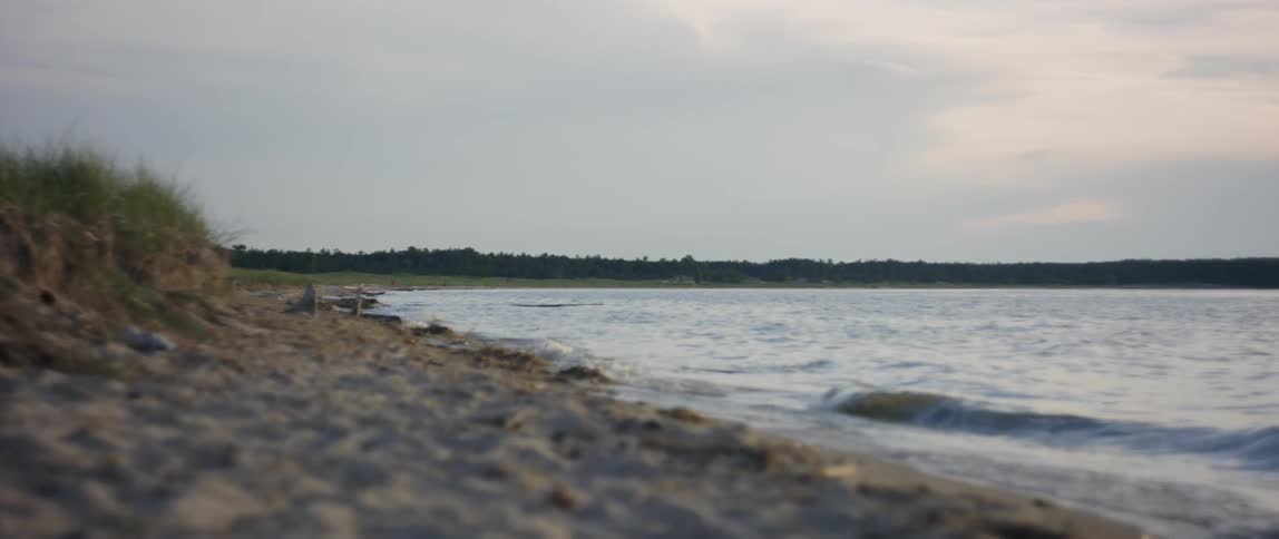 Girl Playing At The Beach