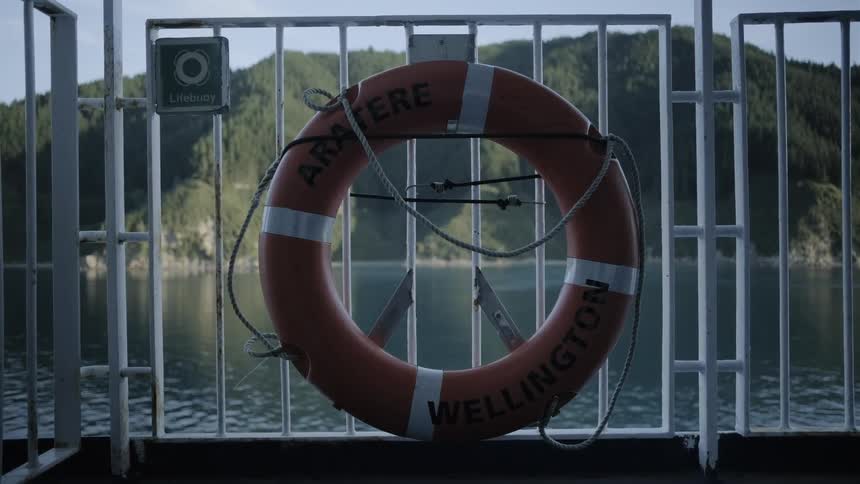 The boat is sailing away from the shore