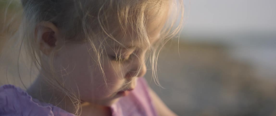 Girl Playing At The Beach