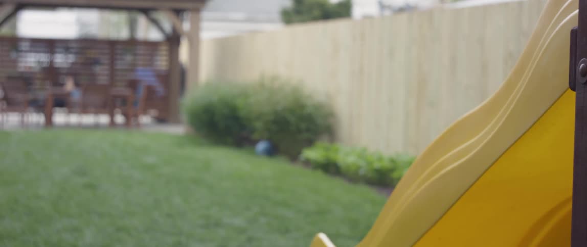 A child swings high on the swing