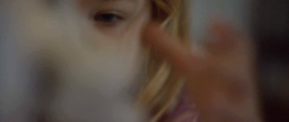The child is playing with a doll