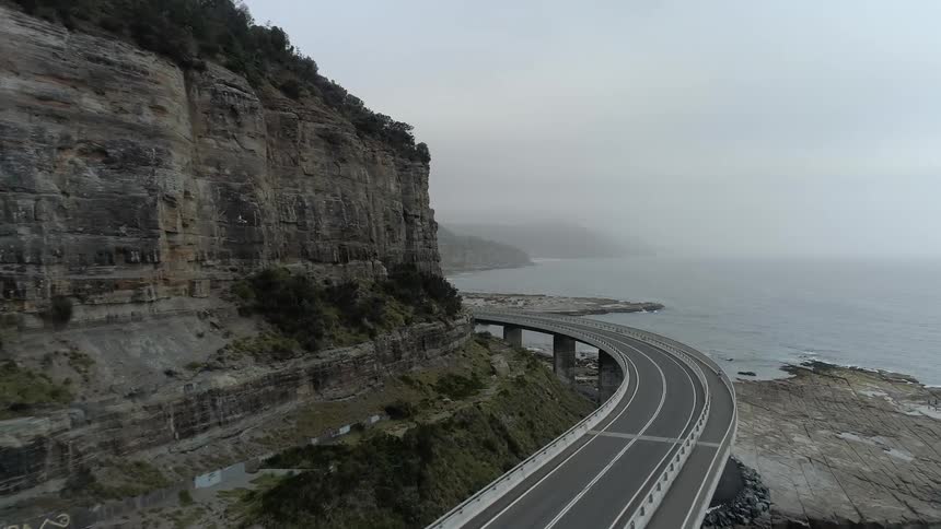 The overpass highway runs by the shore