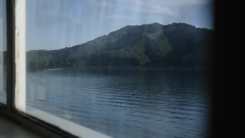 A boat floats on a mountain lake