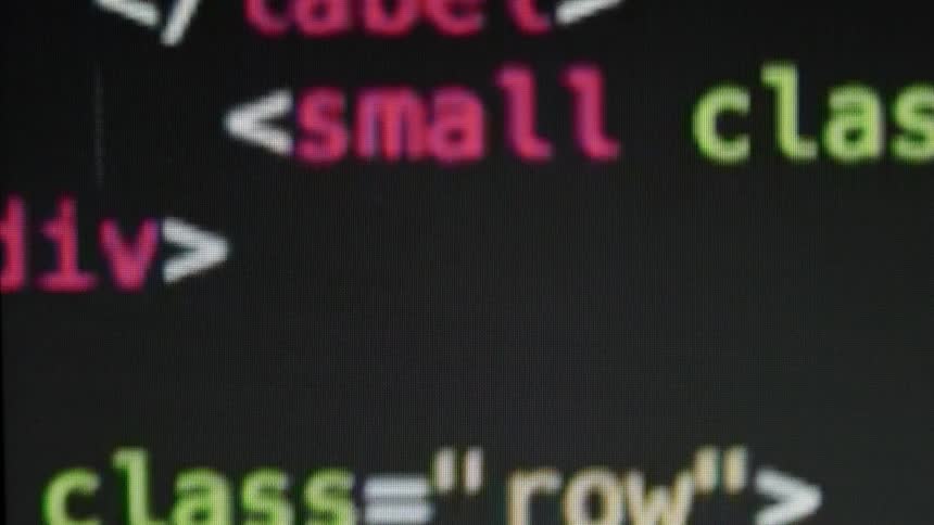 Programming code is displayed on a screen