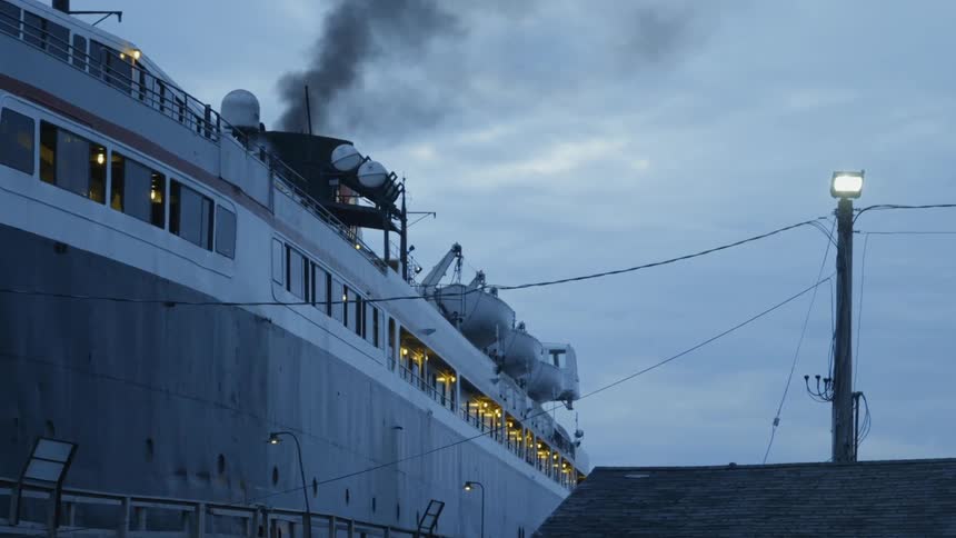 The chimney on the ship is giving off black smoke