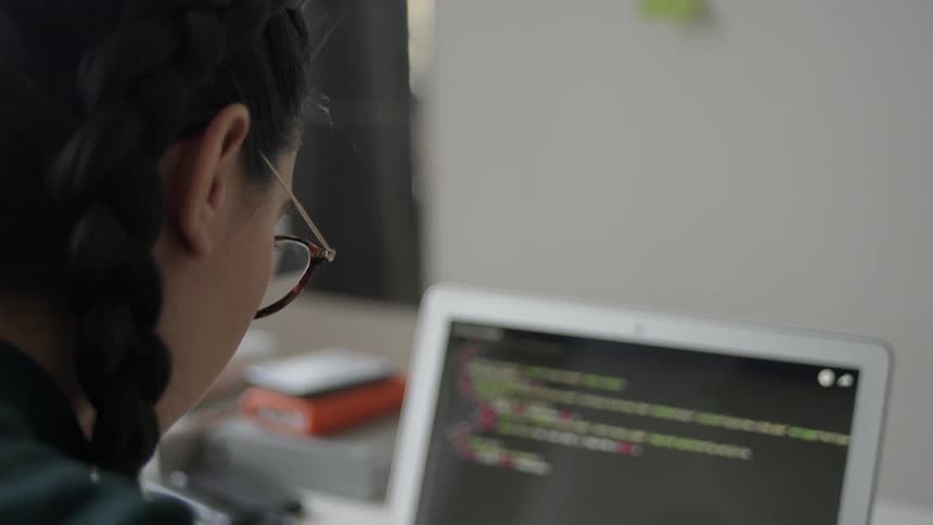 Woman Coding On Laptop
