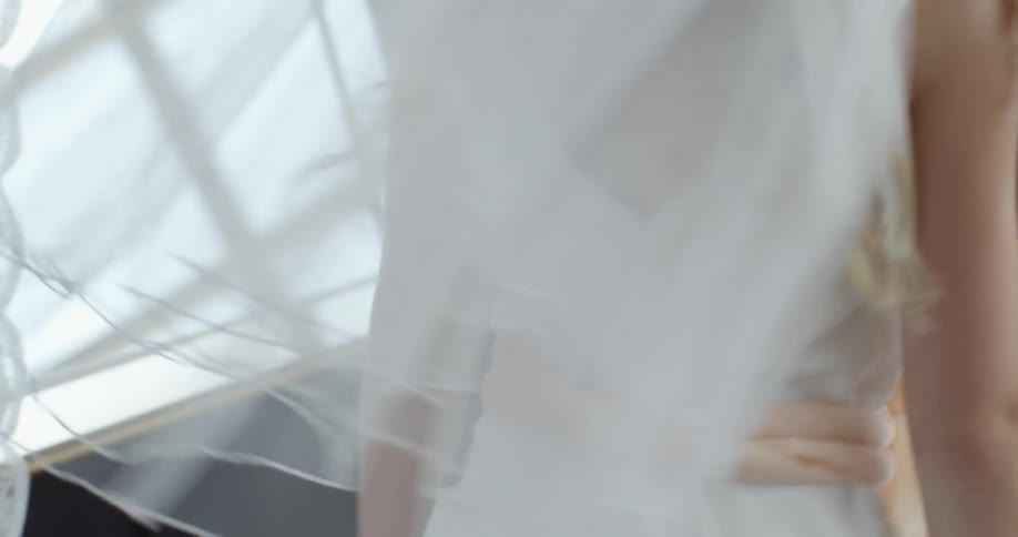 A little girl is spinning in her dress