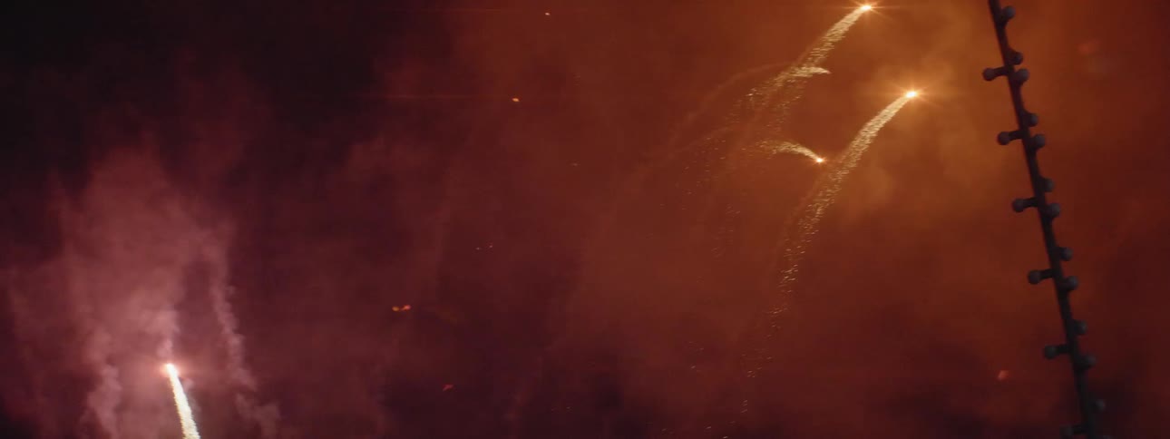 Fireworks explode in the night sky