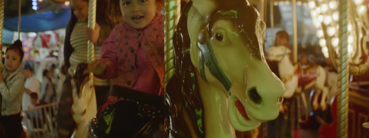 The people are all riding the merry go round