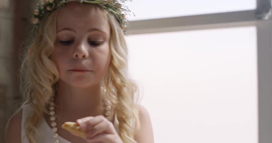 Little girl eating a cookie