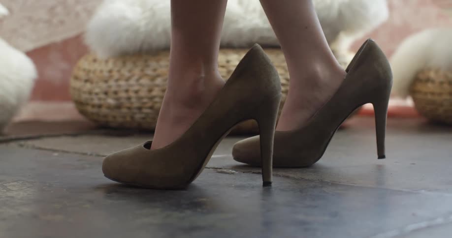 A child wears adult high heels