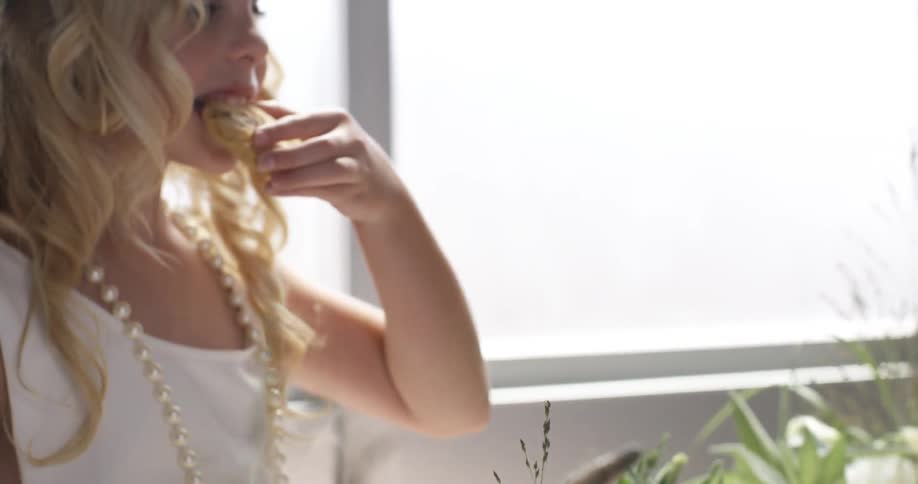 A girl is eating a cooking