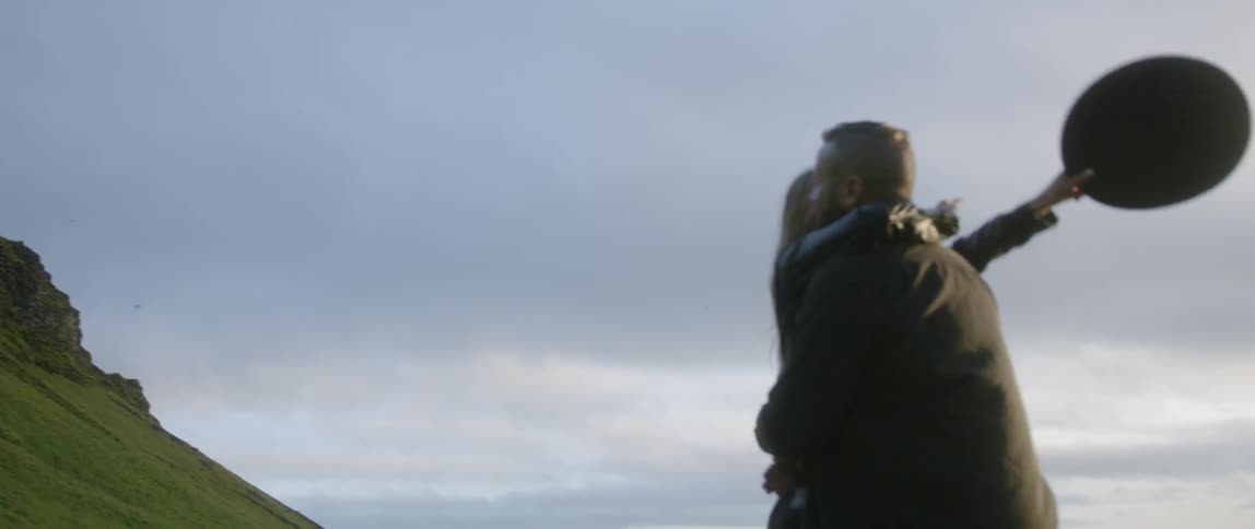 A woman jumps into a man's arms