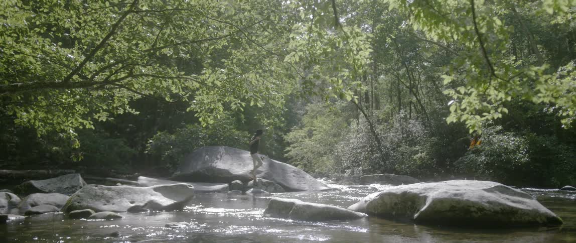 The person cross the stream ahead