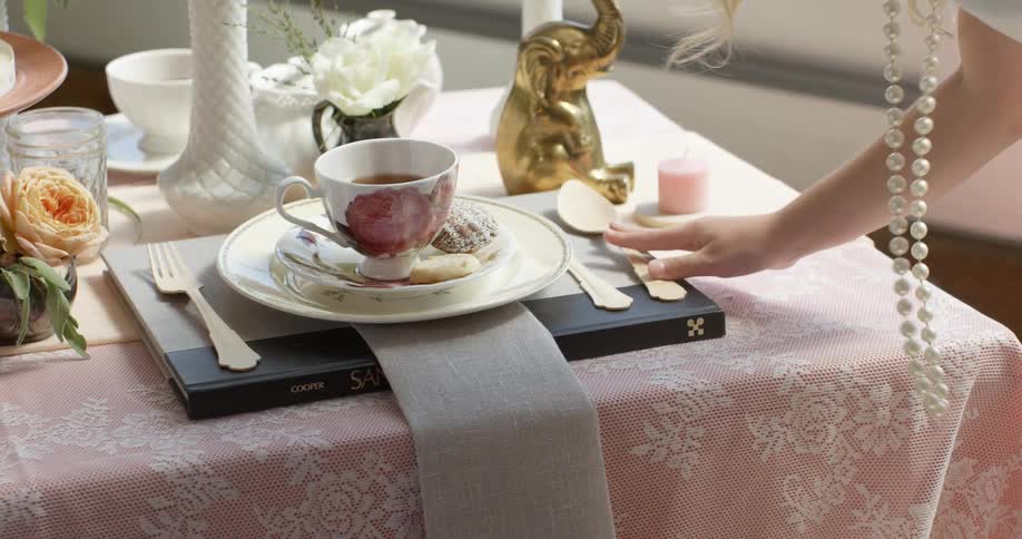 A woman sets a table
