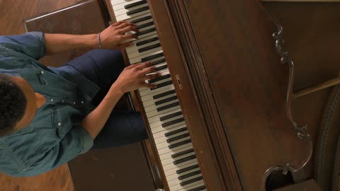 A man plays piano