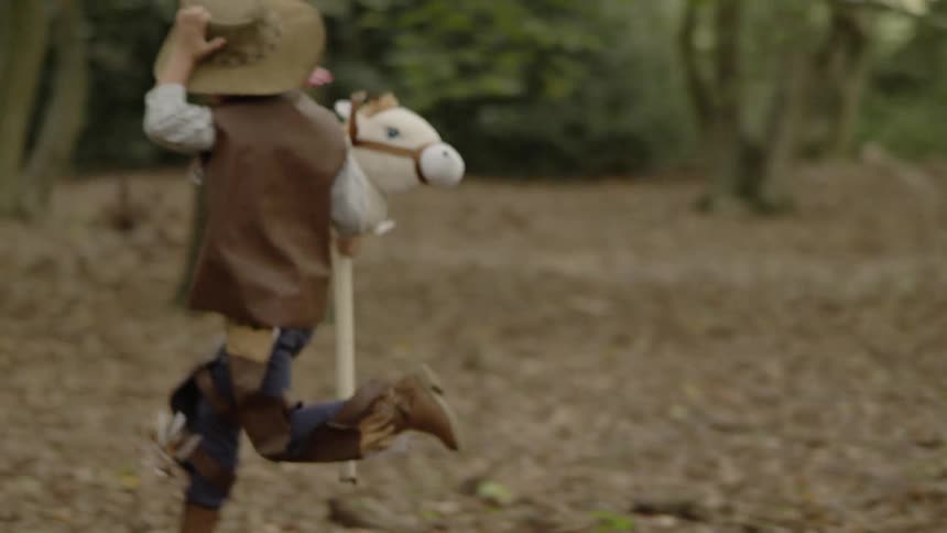 The children race through the forest