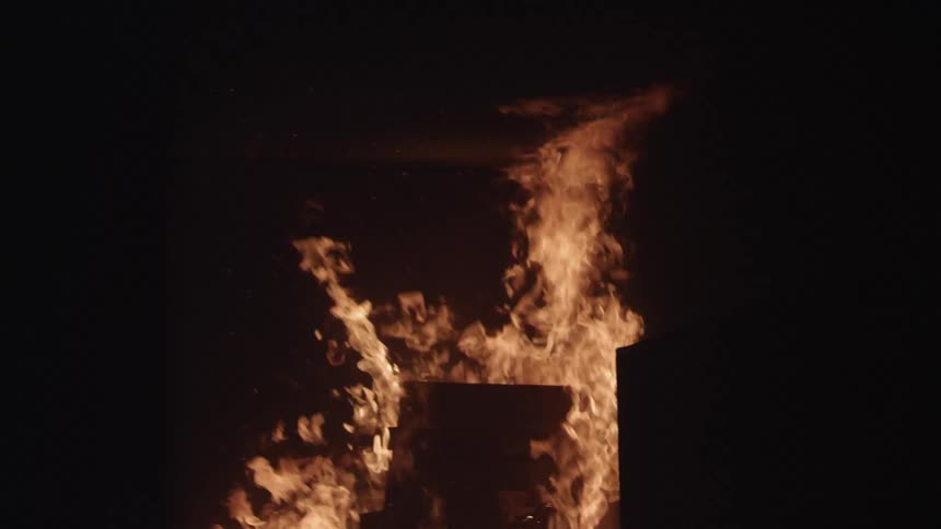 Firefighters In Burning House