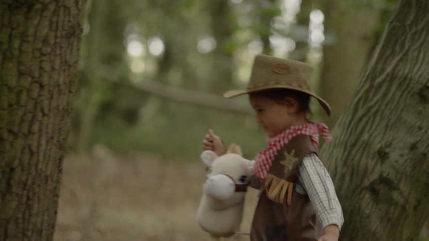 Boys In Costumes Playing In Forest