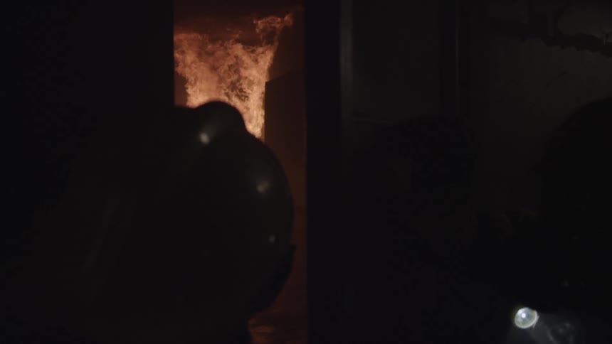 The firefighters enter the burning home