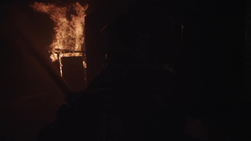 Firefighters In Burning House
